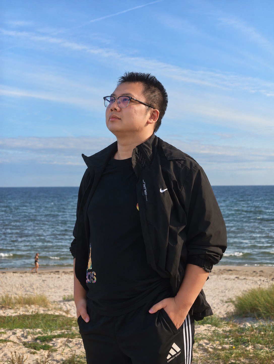 Chengyao Wang standing by the sea
